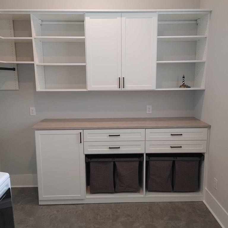 Elevated Laundry Room Upgraded laundry room with hamper storage