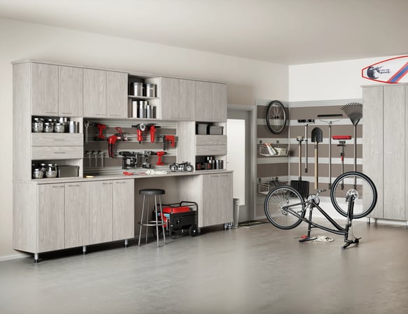 Garage storage with custom cabinets, drawers, workbench, and tool rack by California Closets Norwalk, Connecticut.