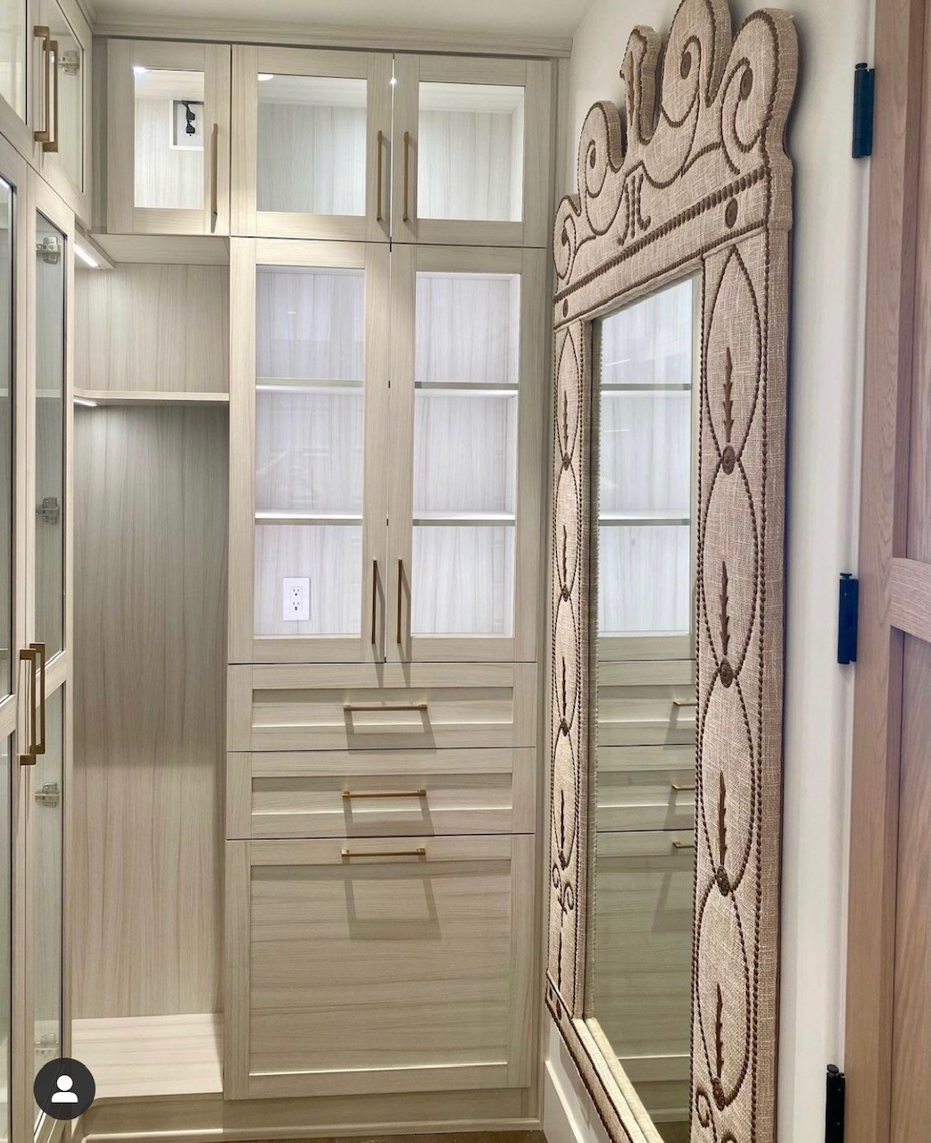 Tan closet shelving with organized clothes and accessories Tan grey walk-in closet shelves with organized clothes and accessories