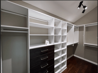 Beautiful Walk-in Beautiful walk-in closet with black and white finishes.