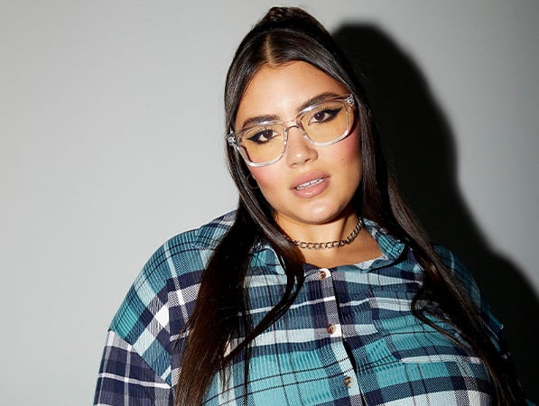 plus girl in sweater flannel ready for fall shopping at rue21