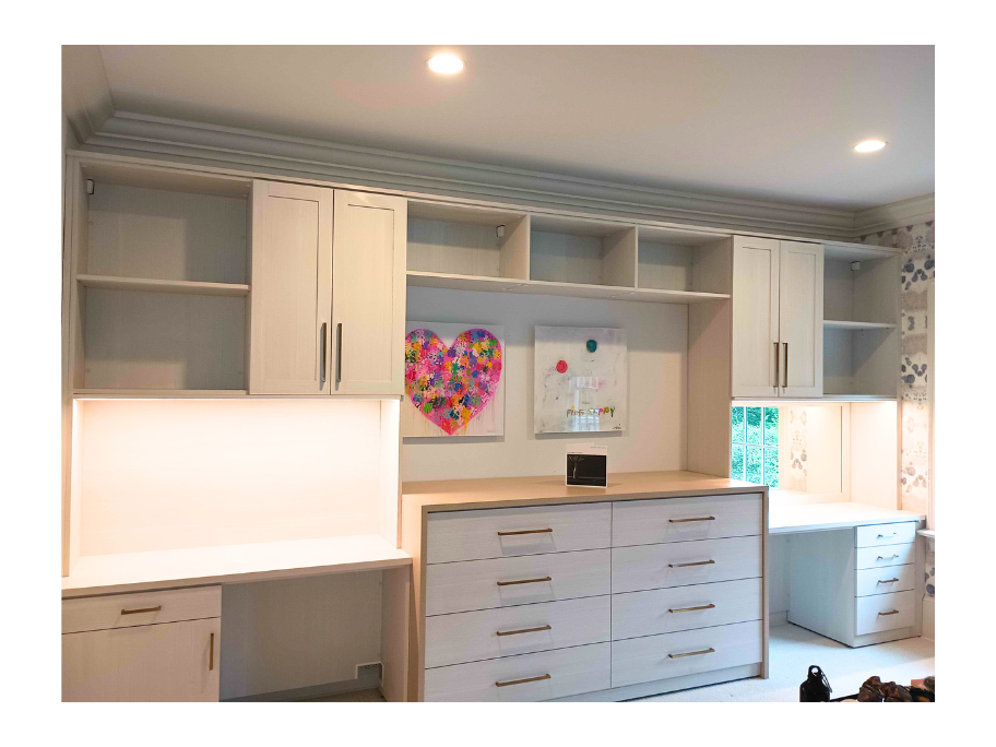 Kids Bedroom Wall Unit Light wood finish kids dresser with vanity on right and desk on left and upper cabinets and shelving