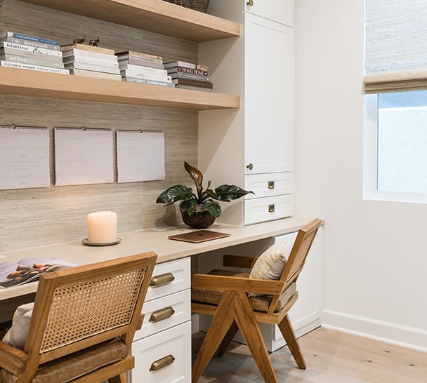 Home Office Work Stations | California Closets Orange County Dual home office with shelves and cabinets in light wood by California Closets Orange County.