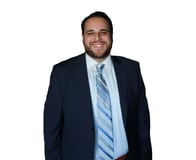 A headshot of Goosehead agent Roly Calderin