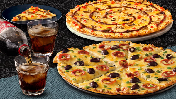 Amazing pizzas from Debonairs Pizza with a glass of Coke.