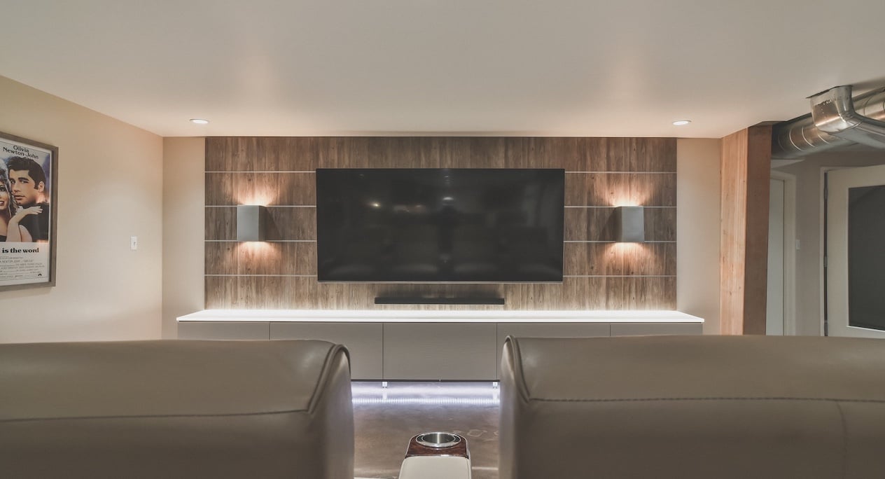 Custom Media Center Modern media center with tv and pieces of wall art