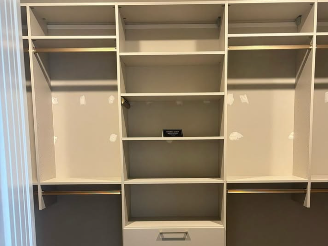 Luxury walk-in closet Luxury white walk-in closet with glass cabinets