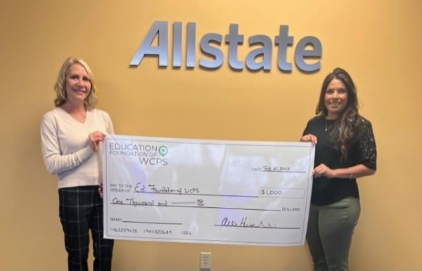 Alex presents a $1000 Allstate Foundation Helping Hands grant Shelia Evers (left) from the Education Foundation of Washington County Public Schools.