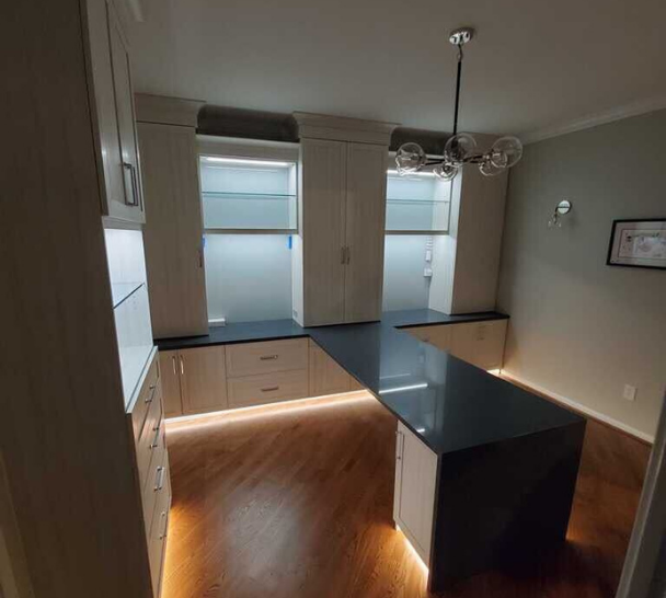 Craft Room Craft room with shelving, cabinets, drawers, and a counter.