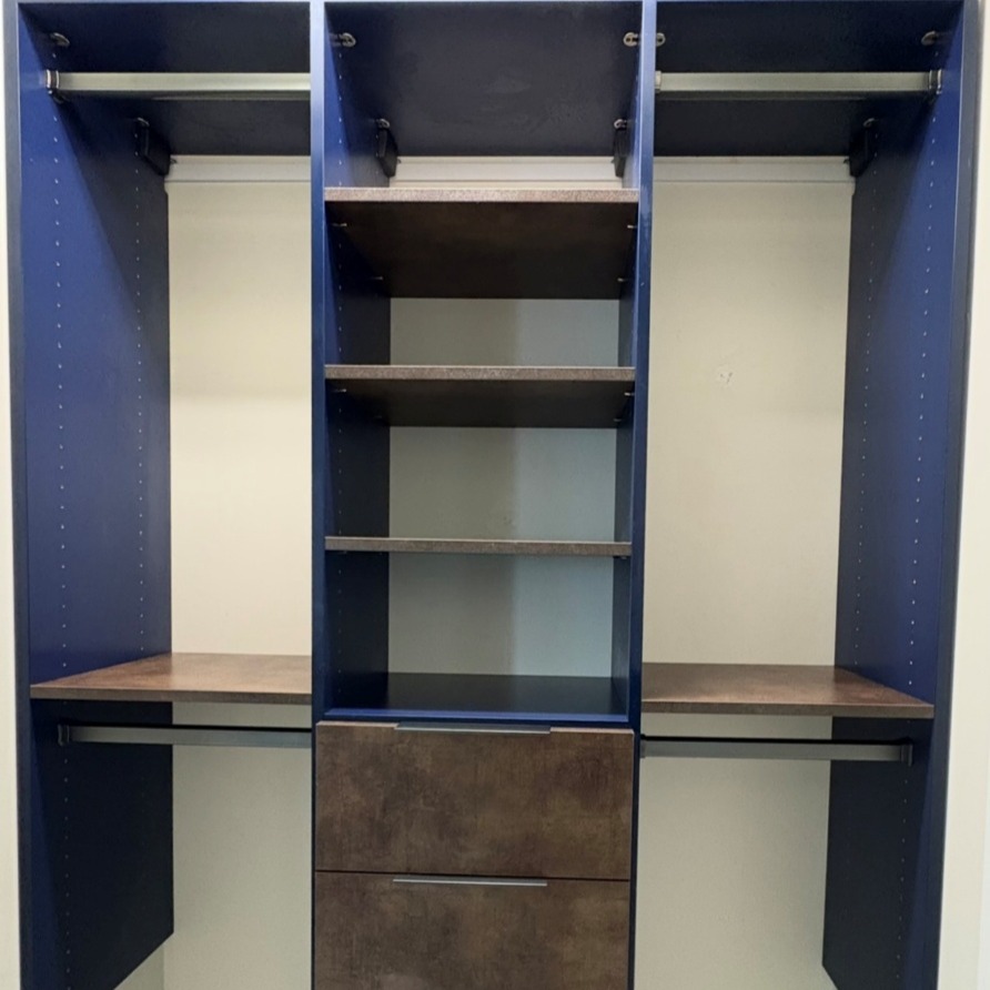 Stylish Guest Closet Custom blue wave and Maya Bronze guest closet with matte nickel hardware.