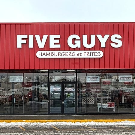 Exterior image of the Five Guys location at 3836 Taschereau Boulevard in Greenfield Park, QC.