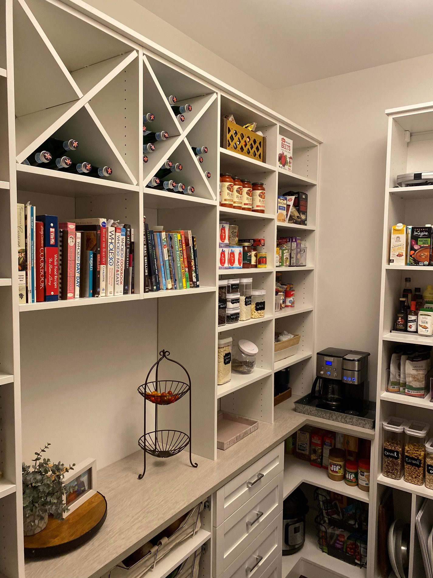 Kitchen pantry with shelving, wine storage, and kitchen pantry cabinets by California Closets Cleveland, Ohio.