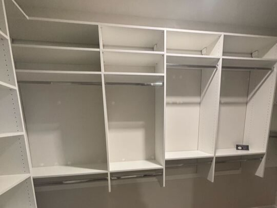 Virginia Beach - Custom closets - Spacious walk-in closet with white shelving, double hanging rods, and open storage.