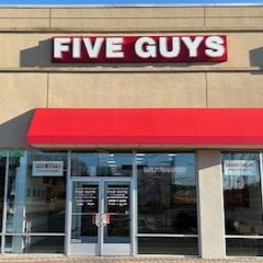 Exterior photograph of the Five Guys restaurant at 2301 Route 66 in Ocean, New Jersey.