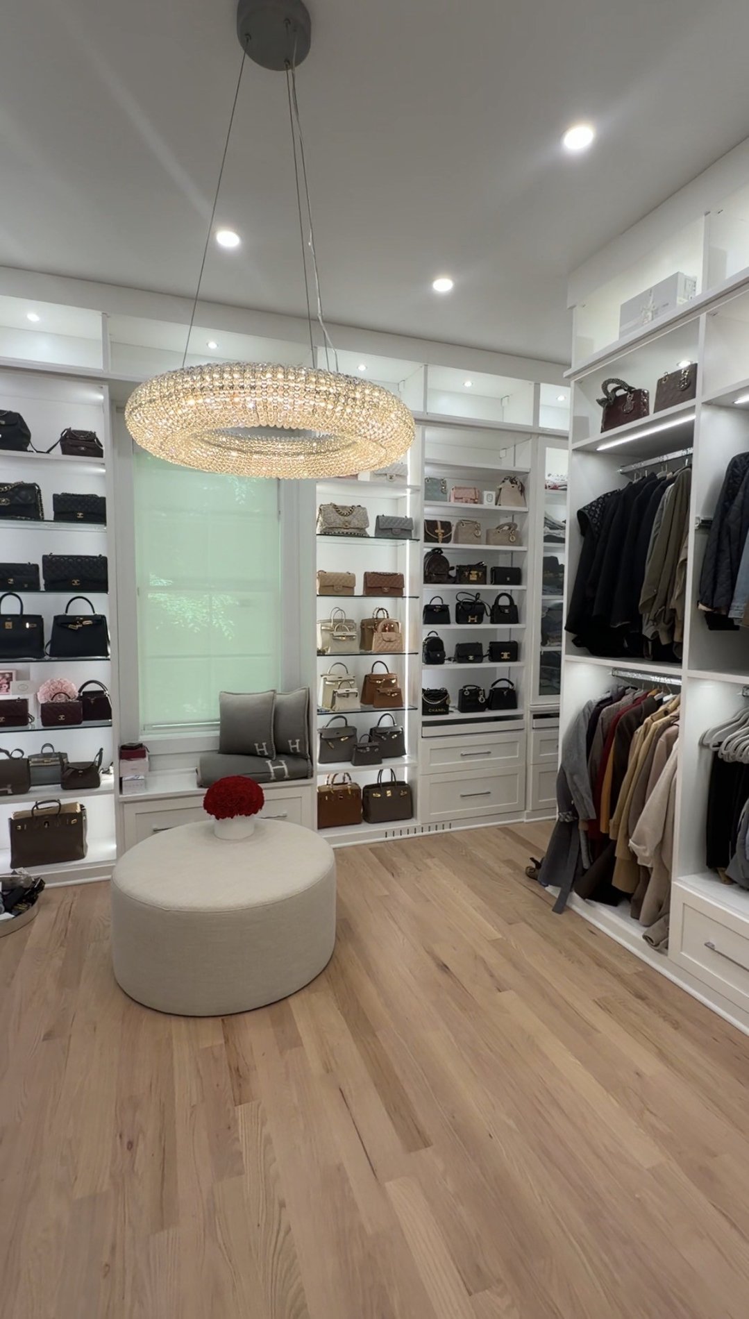 Custom Closet with drawers, lighting, custom shelving.