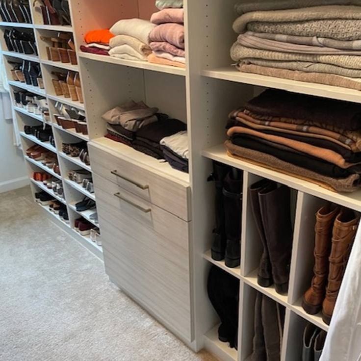 Richmond - Custom closets - Organized walk-in closet with neatly folded clothes