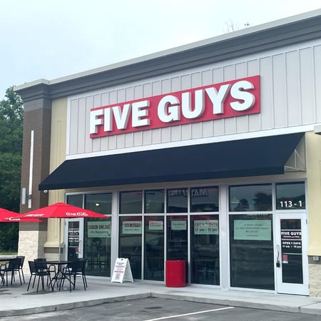 Exterior photograph of the Five Guys restaurant at 113-1 Smith Avenue in Shallotte, North Carolina.