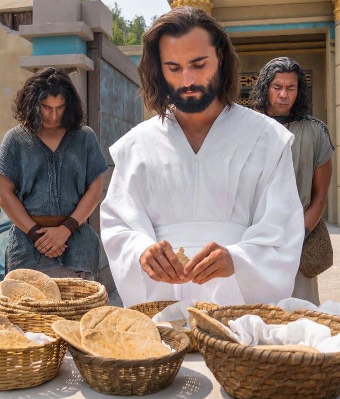 Jesus breaks bread as part of the sacrement.