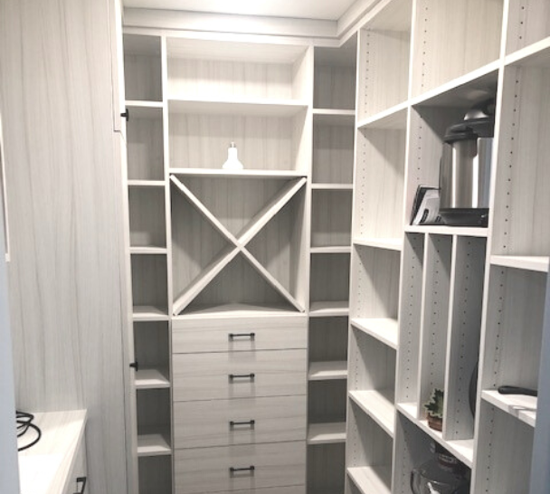 white walk-in pantry with shelving and drawers for food & kitchen appliance storage