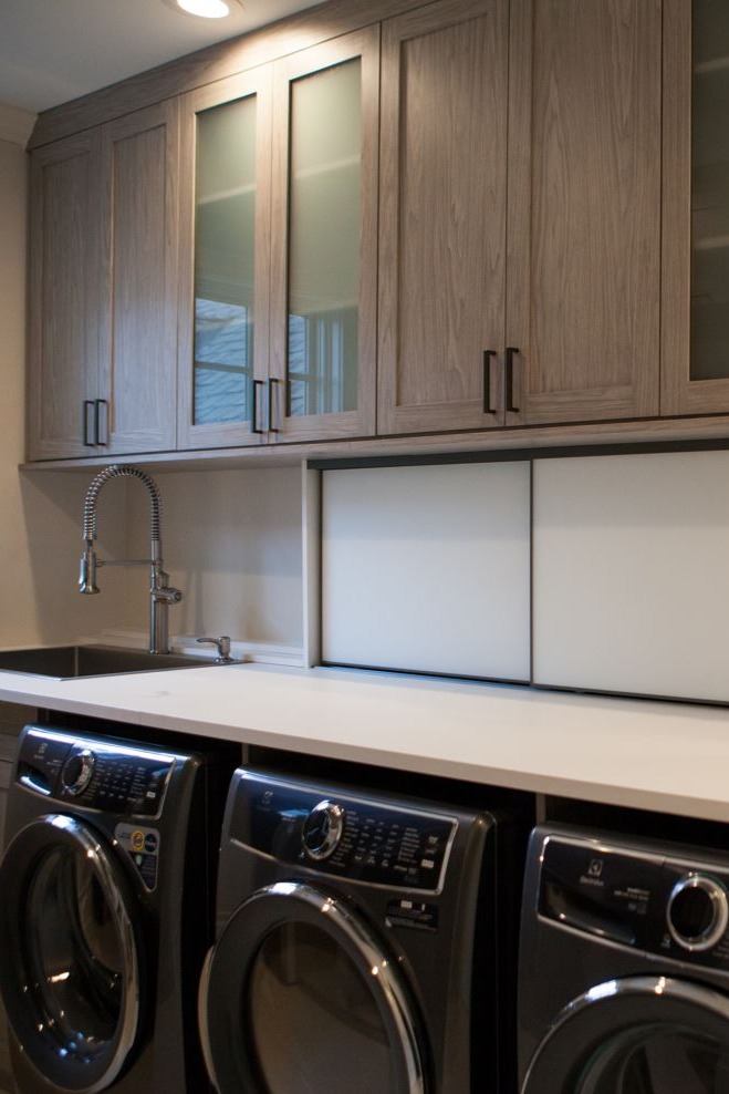 Laundry Room with Frosted Doors and Sliding Panels