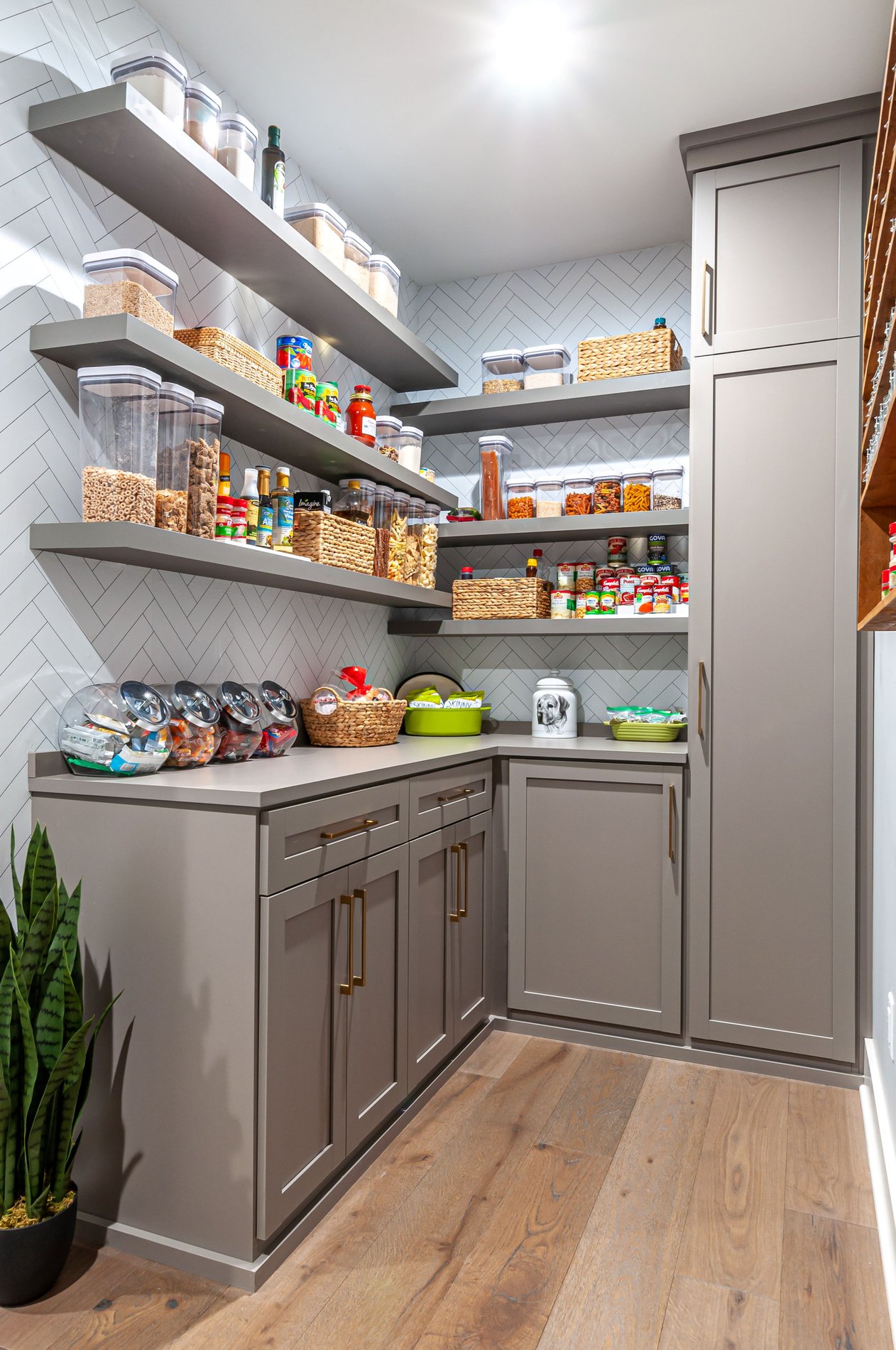 Pantry with grey cabinets, floating shelves by California Closets Northern NJ.