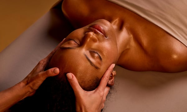 Woman receiving a scalp massage
