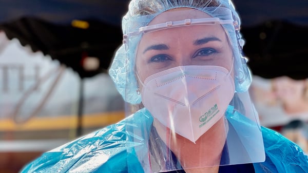 A Borrego Health employee wears a mask and face shield.
