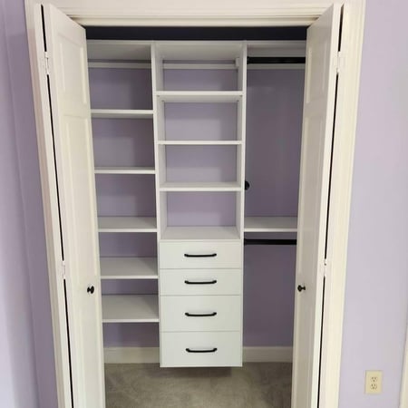 Built-in shelves and drawers designed for efficient storage.