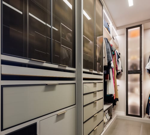Luxurious walk-in closet with custom storage by California Closets Nassau County, New York