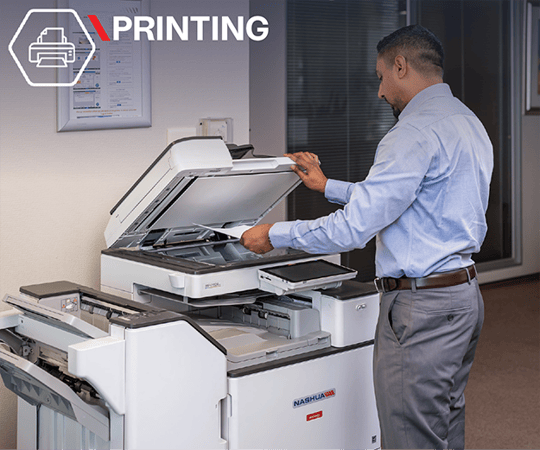 Man using a multi-function office printer