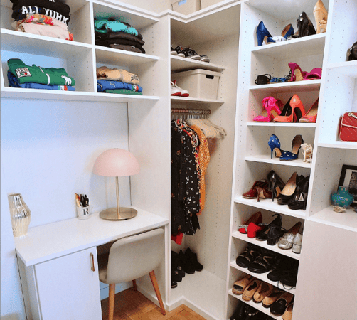 white basic walk-in closet with shoe wall collection, built-in custom vanity, hanging for long dresses and open shelving Upper East Side New York City