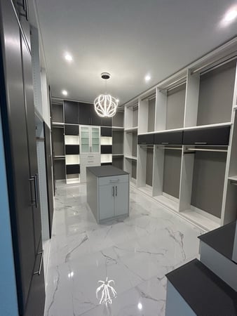 WALK IN CLOSET with an ISLAND and a VANITY in DOVE with SUPERMATTE FRONTs, SQUARE MITER with RAIN GLASS and GLASS COUNTERTOPS and LED lighting