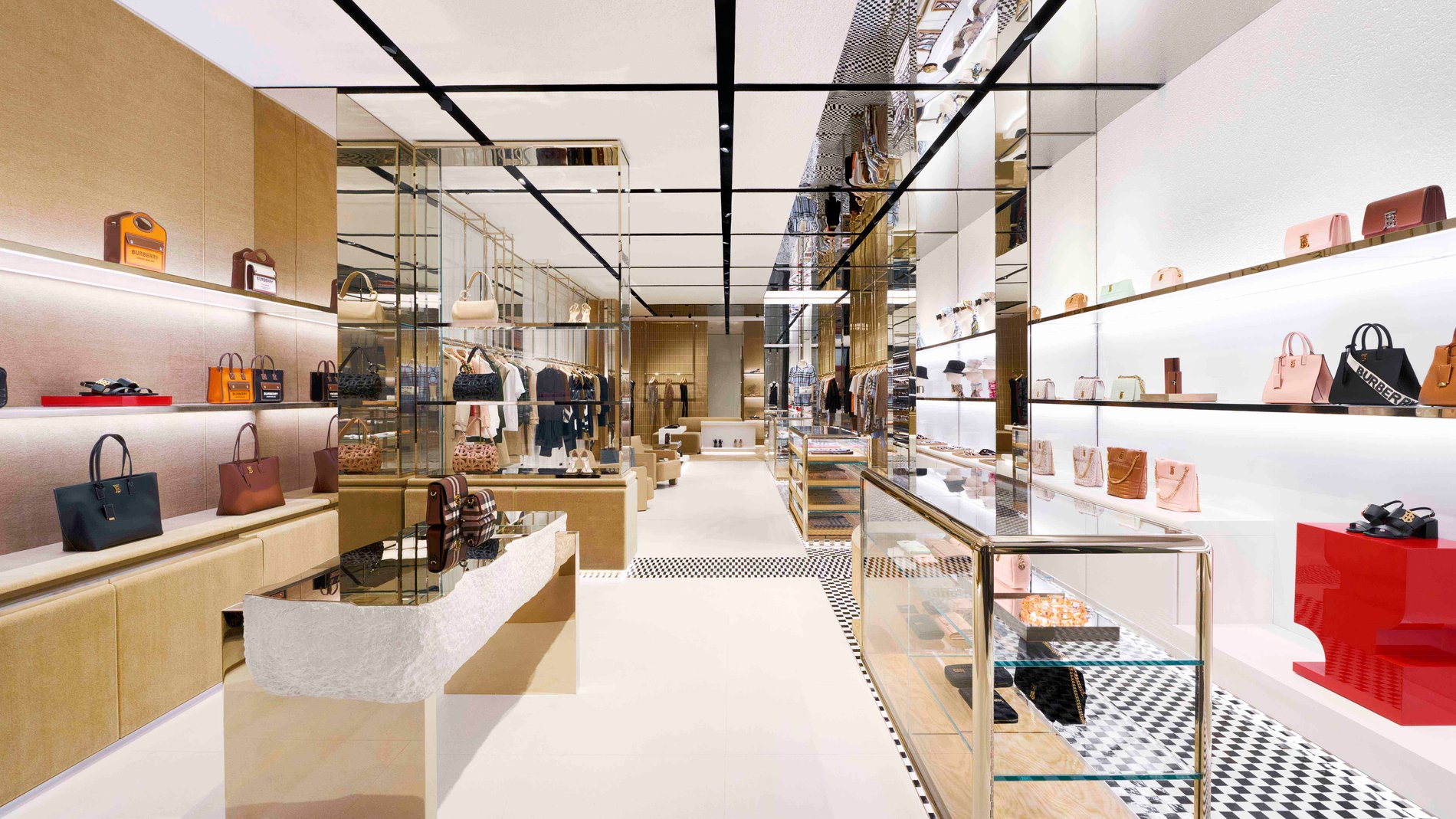 Burberry store close-up with shoes and bags on shelves.