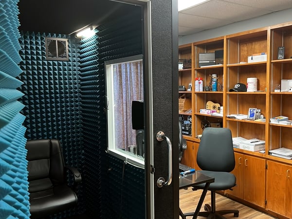 Interior photo of the hearing exam booth office for AudioNova hearing clinic in Tavares, FL