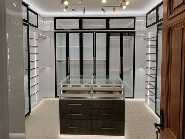 Walk-in closet with center island and glass doors California Closets Pensacola and Panama City, Florida