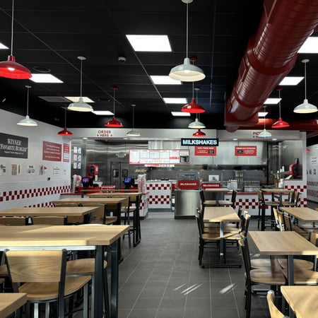A photograph of the remodeled dining room and kitchen ahead of the reopening of the Five Guys restaurant at 4324 Washington Road in Evans, Georgia.