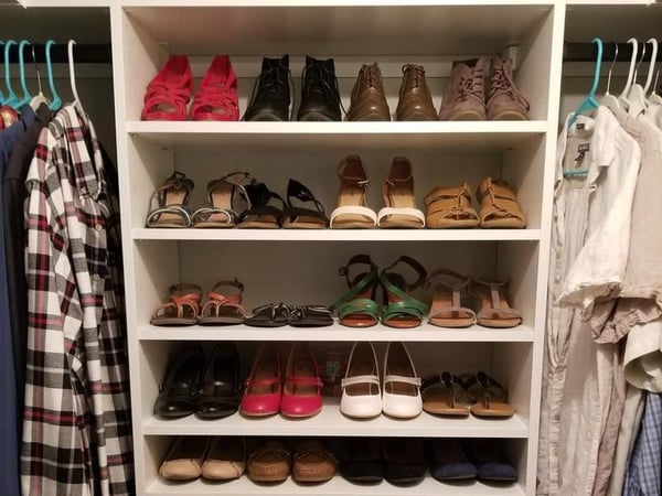 Greensboro - Custom closets - wrap-around corner shelving with organized shoes and clothing