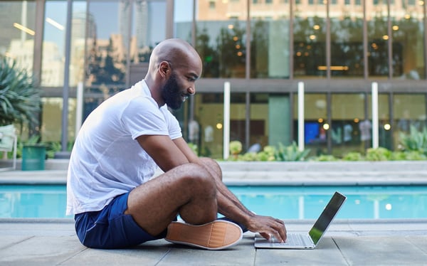 Man using WiFi in downtown Denver, CO