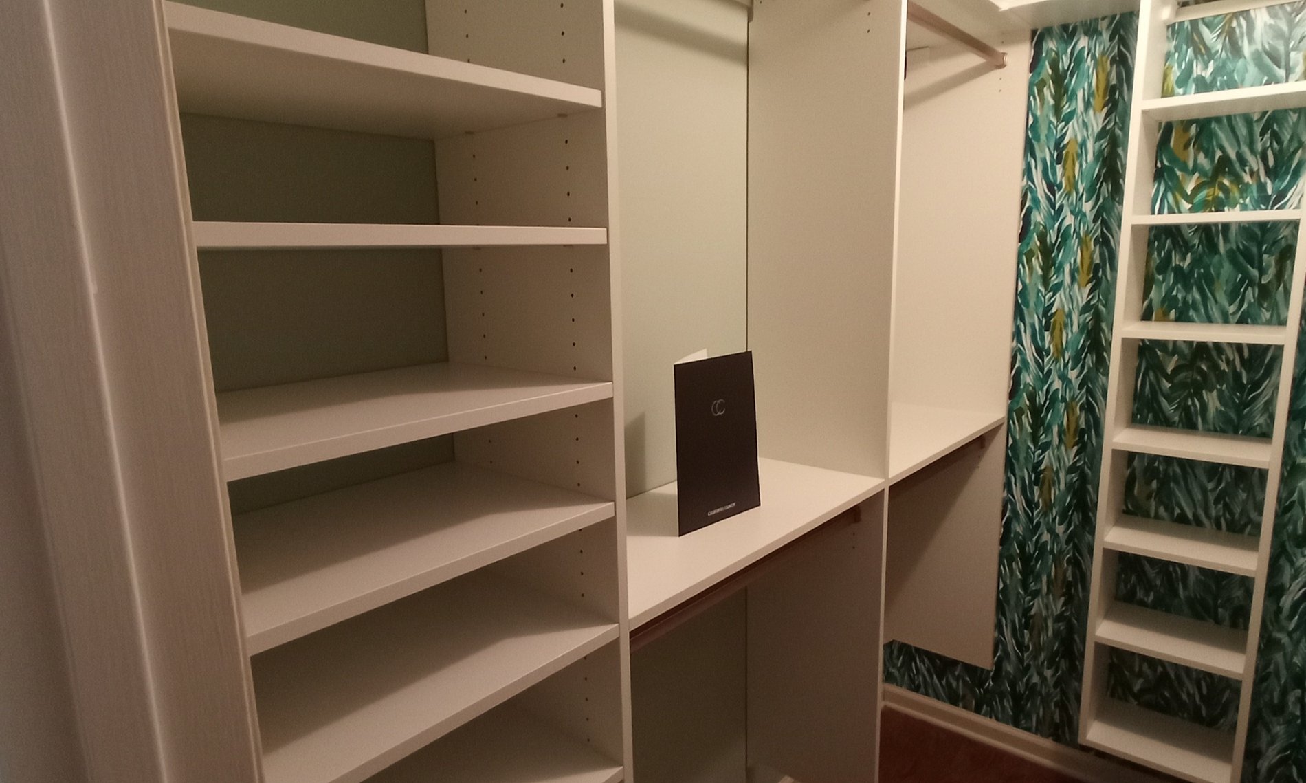 Walk-In Closet with Accent Wallpaper