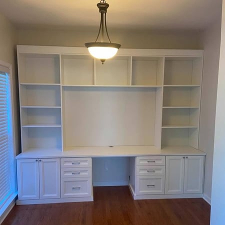 Richmond - Custom closets - White entertainment center with shelves and drawers surrounding a cutout for a tv