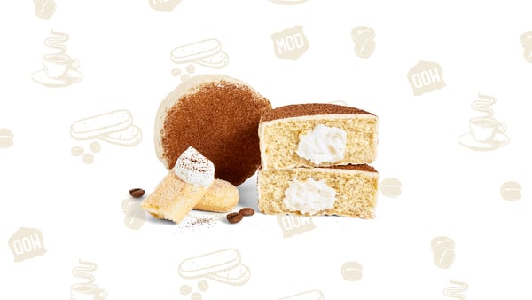 Two coffee flavored cakes, one sliced open to show mascarpone-style cream filling.