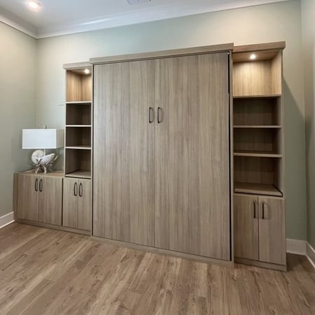 Murphy beds in a wall with bookcases and bookshelves California Closets Pensacola & Panama City, FL