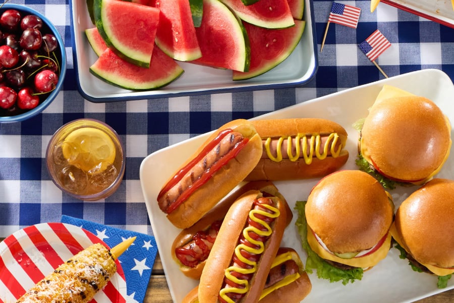 fourth of july hamburgers hot dogs watermelon corn on the cob and sides