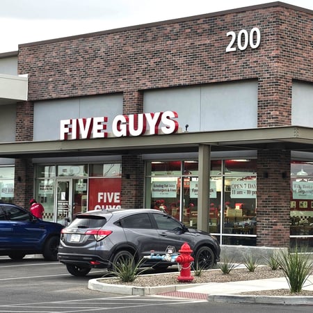 Exterior photograph of the Five Guys restaurant at 37666 North Gantzel Road in Queen Creek, Arizona.