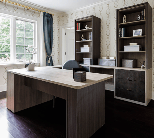 California Closets Westchester NY Brown Home Office custom built workspace with cubby-like bookshelves on each side and black leather drawers