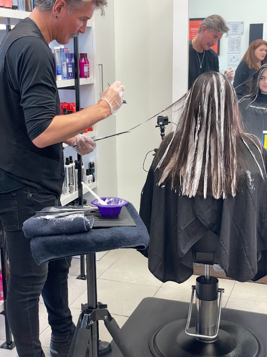 Woman getting hair color service in Hair Cuttery