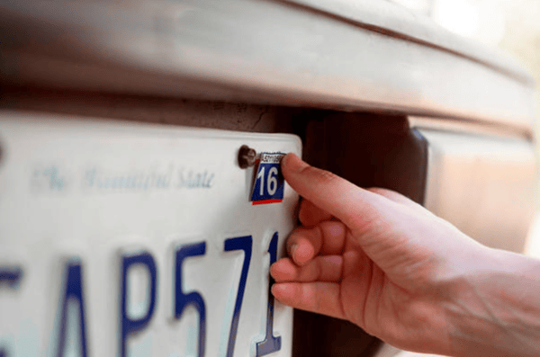license plate with car registration stickers renewed at AAA