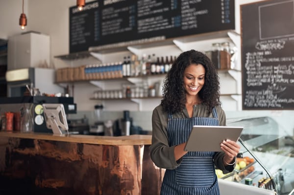 Cafe owner on tablet