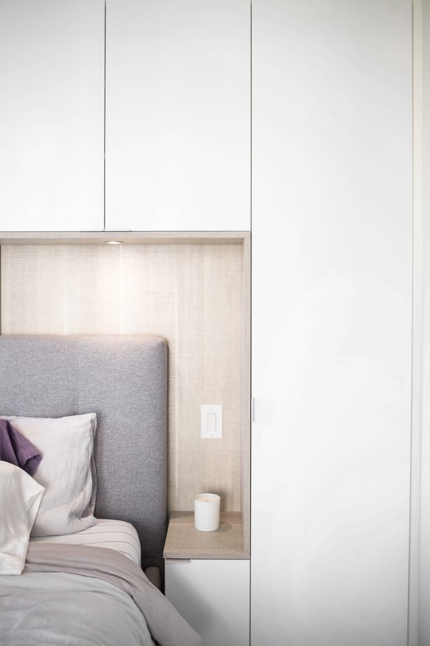 Built in cupboards and bedside tables with space left for bed