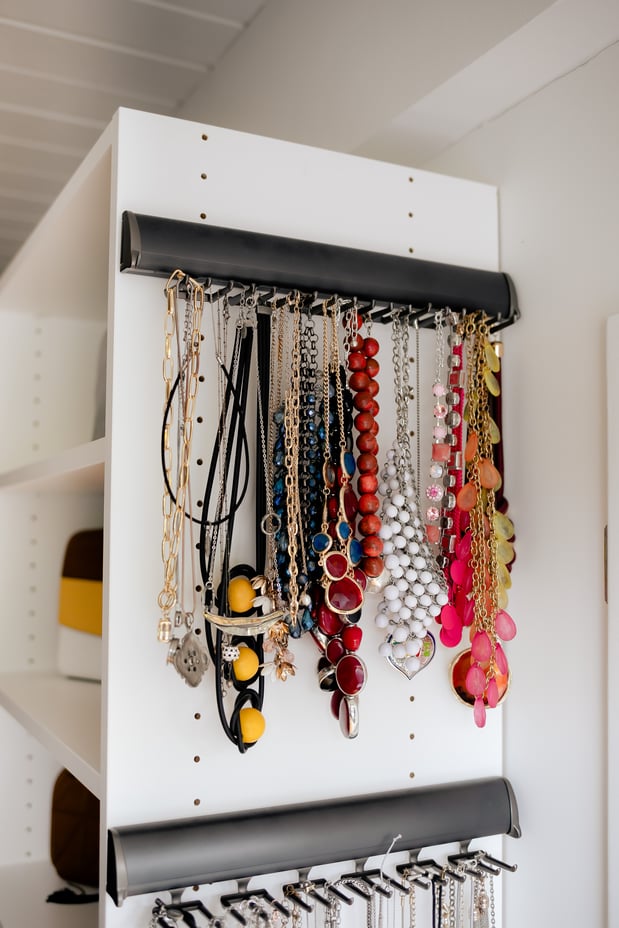 Close up of pull out racks for hanging jewelry